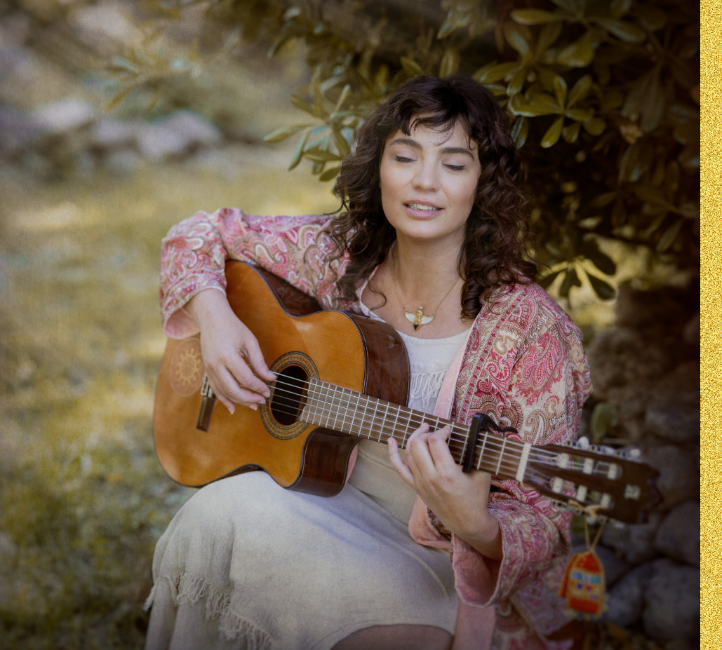 Noelia Ruiz with guitar for sound and somatic healing work